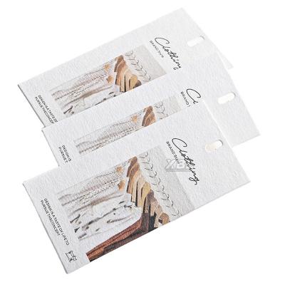 China Viable High Quality Thick Paper Clothing Tag Simple Style Personalized Fashion Clothing Luxury High Quality Hang Tag for sale