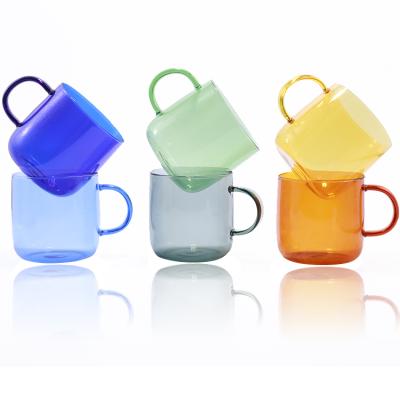 China Food Grade High Borosilicate Safe Water Cup Milk Cup Juice Heat Resistant Handmade Colored Glass Cup With Handle for sale