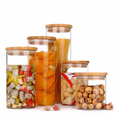 China Feature Clear Borosilicate Glass Food Storage Jar Eco-friendly Heatable Spice Jar With Bamboo Lid for sale