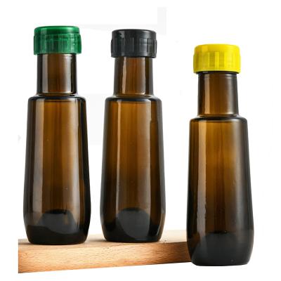 China Amazon 100ml Sustainable Round Brown Olive Oil Glass Bottle Empty Vinaigrette Cooking Wine Bottle Seasoning Bottle for sale