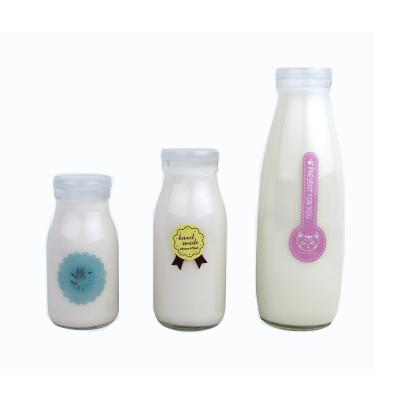 China 200ml250ml500ml1000ml Milk Yogurt Juice Drinks Transparent Modern Popular Premium Milk Bottle Fresh Wear-Resistant Drink With Iron Lid for sale