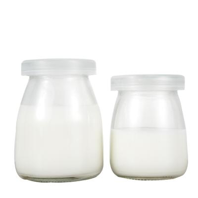 China New Design Pudding Bottle Eco - Friendly Recyclable Fashionable Kitchen Recyclable Transparent Glass Bottle for sale