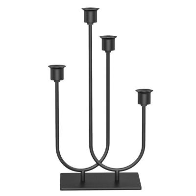 China Modern simple novelty hot sale style wedding table centerpieces iron black iron metal candlestick candle holders for sale