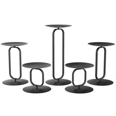 China Hot Selling Black New Arrival Oval Geometric Design Wedding Table Decoration Iron Metal Pillar Vintage Candle Holder Stands for sale