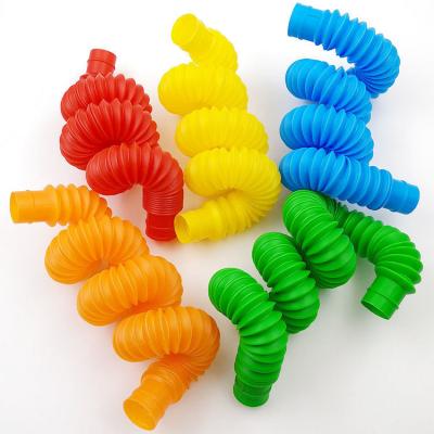 China Diy Sensory Tools Eco-friendly Material Plastic Colorful Busy Person Building Pop Up Pipe Tubes Stress And Worry Relief Toys For Stretch Autism Children for sale