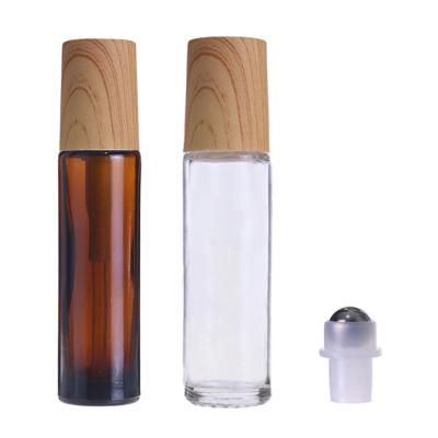 China 5ml 10ml cosmetic cheap roll on bottle bamboo cap rollerball glass bottle for essential oils matte frosted roll glass bottle 15ml for sale