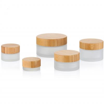 China Cosmetic bamboo cosmetic packaging 5g 10g 15g 20g 25g 30g 50g 60g 100g frosted glass cream jar with bamboo lid for sale