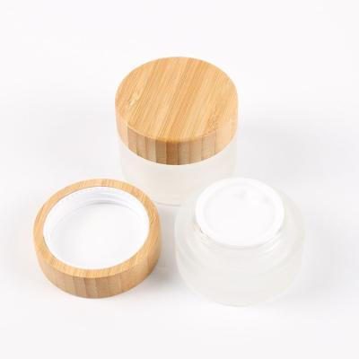 China Small frosted bamboo glass jar of clear glass cosmetic cream packaging cream jar for sale