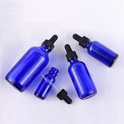 China 5ml 10ml 15ml 20ml 30ml 50ml 100ml 2oz Round Dropper Essential Oil Cosmetic Blue Glass Bottle for sale