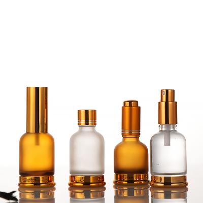 China Custom Logo Cosmetic Luxury Gold Essential Oil Bottle Glass Dropper Bottle Essential Oil Glass Bottle for sale