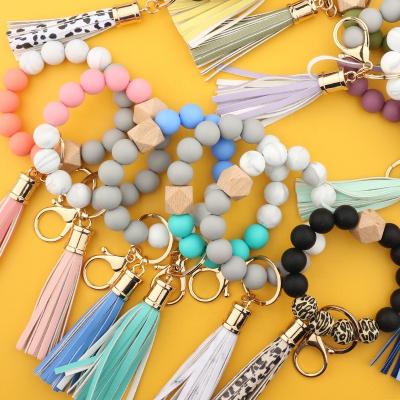 China 2021New Tassel Beads Bracelet Jewelry Silicone Leather Casual/Sporting Bracelets Molar Silica Gel Wood Keychains Bracelet for sale