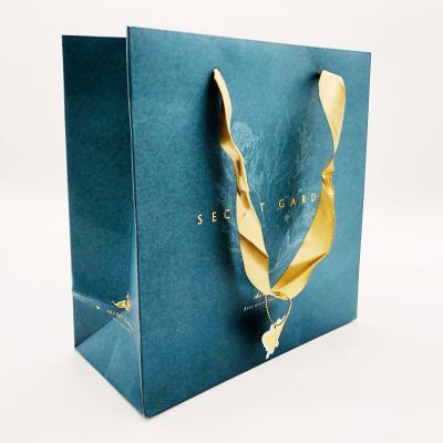 China Recyclable Custom Printed Green Craft Paper Grocery Bag For Clothing Packaging for sale