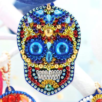 China Eco-Friendly New Product Ideas Skull Shape Resin Double Side Sequins Painting Key Chain Set Weekly Business 2021 for sale