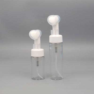 China Non Spill New Design Heart Shape Plastic Bottle With Foam Pump Tops And Silicone Brush Cap For Beauty Care for sale