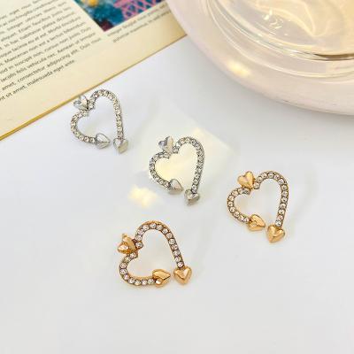 China FASHION New Arrival Cubic Zircon Stud Earrings Shape Love Heart Geometric Hollow Earrings Female Stud Earrings for sale