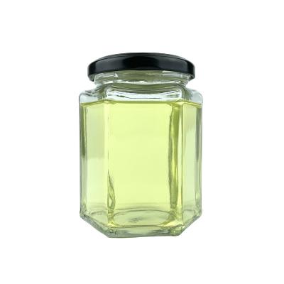 China Empty Freshness Preservation Hex Honey Glass Jars Clear With Metal Lid for sale