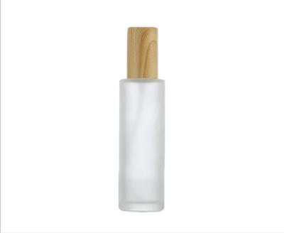 China 60ml Grain Cover Frosted Glass Cosmetic Wooden Bottle Printing LOGO Portable Empty Skin Care for sale