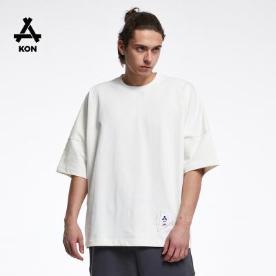 China Anti-Wrinkle KON 300GSM Free Size Short Sleeve T-Shirt Off The Shoulder High Quality 100% Cotton Embroidered Logo Boy Oversized T-Shirts for sale