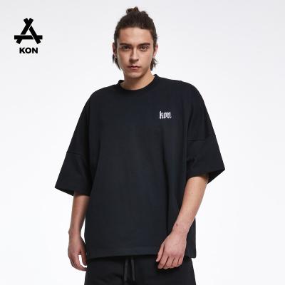 China Anti-wrinkle KON 300GSM short sleeve t-shirt off the shoulder embroidery high quality logo free size 100% cotton boy oversized T-shirts for sale