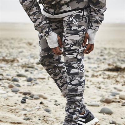 China Leisure muscle fitness brothers autumn and winter men's outdoor sports camouflage casual stretch slim pants for sale