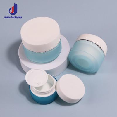 China 15g 20g 30g 50g Gezichtscrème Blauwe pot Matte PP Plastic Creme Jar Met Gouden Draad Deksel Te koop