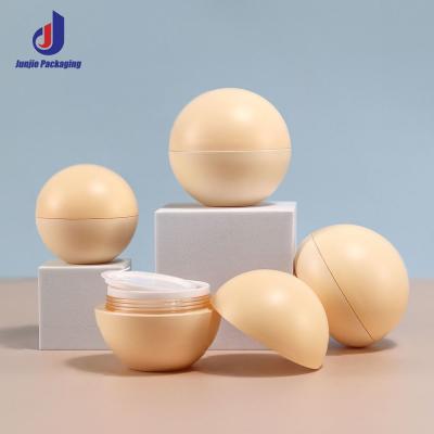 China 10g 15g 20g 30g 50g Jarrón de plástico vacío de forma de bola, balsamo labial, frascos de crema con tapa en venta