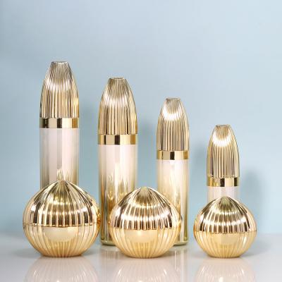 China Electroplate Luxury Acrylic Set Liquid Foundation Bottle Face Cream Jar Pumb Spray Bottle For Cosmetic Packaging for sale