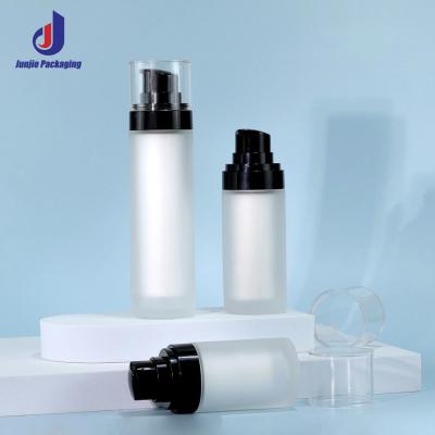 China Botella de la bomba de la crema para el cuidado de la piel Botellas redondas de PET transparentes con tapa en venta