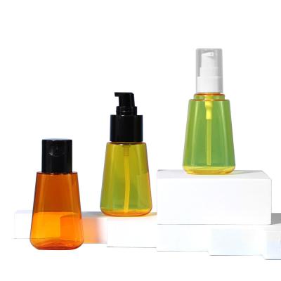 China PET Clear Lotion Bottle Cosmetic Hair Oil Empty Bottle 70ml With Black Pump Head for sale