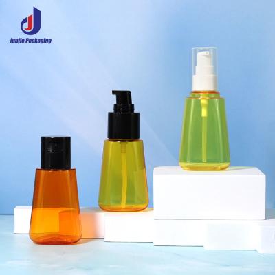 China PET Clear Lotion Bottle Cosmetic Hair Oil Empty Bottle 70ml With Black Pump Head for sale