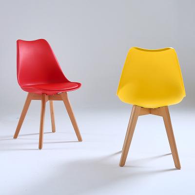 China Wholesale Modern PU Solid Wood Colorful Red Black White Plastic Soft Cushion Chair Legs Nordic Modern Plastic Chair For Sale for sale