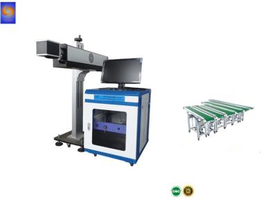 China Bottle Cap Bottled Water 30W CO2 Flying Laser Marking Machine With Conveyor Belt for sale