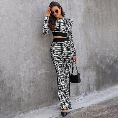 China Autumn Winter Crop Streetwear Long Sleeve Bandage High Top Wide Letter Print Women Two Piece Set for sale