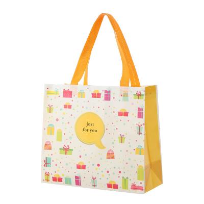 China Reusable Wholesale Cartoon Printing Cute Nonwoven Shopping Tote Bags Foldable Nonwoven Packaging Bag for sale