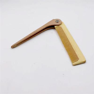 China Useful Mini Hair Folding Pocket Hair Straightener Foldable Wooden Tail Hair Comb for sale