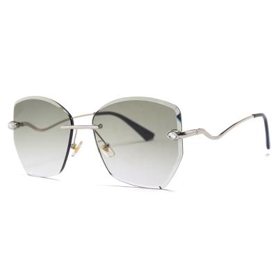 China New Rimless Anti UV400 Lens With Diamond Metal Arms Beautiful For Women 2020 Summer Color Stylish Sunglasses for sale