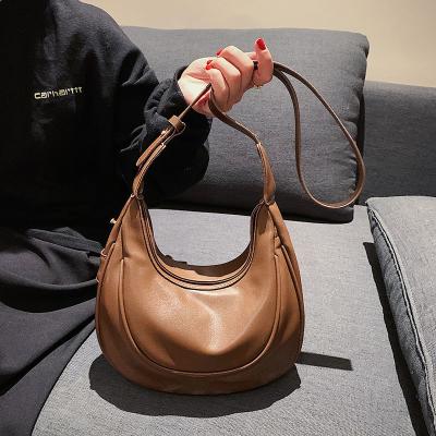 China Madame Taninsy luxury ladies shoulder sling bag custom made PU leather underarm armpit bag for women dumpling moon shape shoulder bag for sale