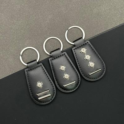 China Promotion gift selling custom logo five-pointed star bulk metal leather key chain key ring for sale