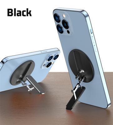 China New Round Desktop Adjustable Magnetic Folding Mobile Phone Stand Aluminum Holder With Kickstand For iPhone for sale