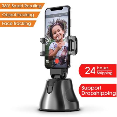 China 360 Degree Object Tracking Holder Rotation All-in-One Face Shooting Selfie Plastic Automatic Smart Stick Tracking Camera Phone Holder for sale