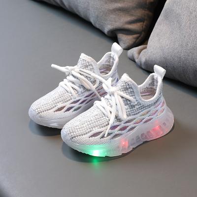 China Massage Fashion Toddler Baby Soft Soled Sneakers Weave Net Outdoor Running Boys Girls Sports Glowing Casual Breathable Shoes for sale