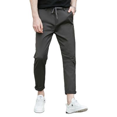 China Custom Logo Casual Men Plain Color Cotton Drawstring Joggers Breathable Anti-Wrinkle Jeans Slim Fit Plus Size Mens Pants And Trousers for sale