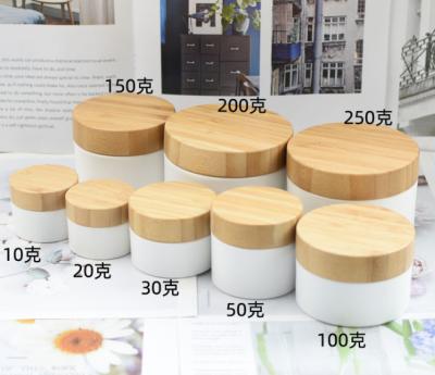 China OEM ODM Bamboo Jar 10 Round Stock Wooden Plastic Container Cap PP Body Cream Jar 20 30 50 100 200 250g With Bamboo Lids for sale