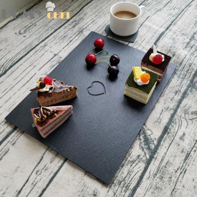 China Sustainable Special Antacid Coating Black Slate Dishes 40x30cm With Engraved Heart Logo And Cut Edge for sale