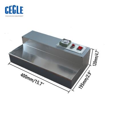 China CW-115 Manual Products Candy Box Cellophane Wrapping Machine for sale