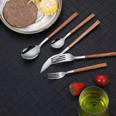 China Disposable 430 Stainless Steel Knifefork And Spoon Web Celebrity Portuguese Wooden Handle Clamping Cutlery for sale