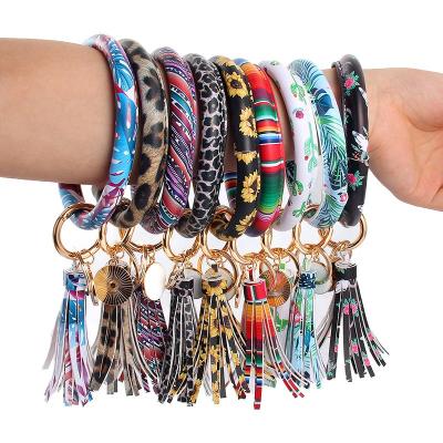 China Lady New PU Leather Key Chain Bracelet Pendant Key Ring O Shape PU Bracelet Tassel Key Chain for sale