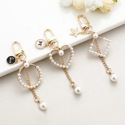 China Advertising Promotion Christmas Gifts Valentine's Day Gifts Love Simulated Pearl Pendant Key Ring Heart Charm Jewelry Keychain for sale