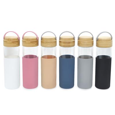 China 650ml Clear Water Bottles With Handle Wide Mouth High Borosilicate Glass Water Bottle with Bamboo Lid for sale