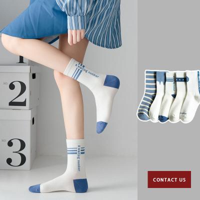 China Sporty socks wholesale women's tube jars fashionable white women's CIA solid color all season cotton socks stockings for sale